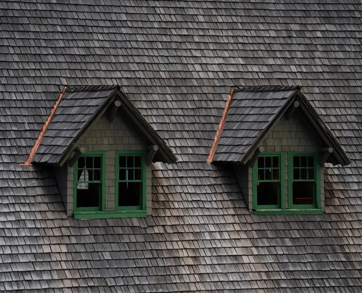 Dormers on a shingle roof in Hollywood, FL, where step flashing and kickout flashing carry water past the walls